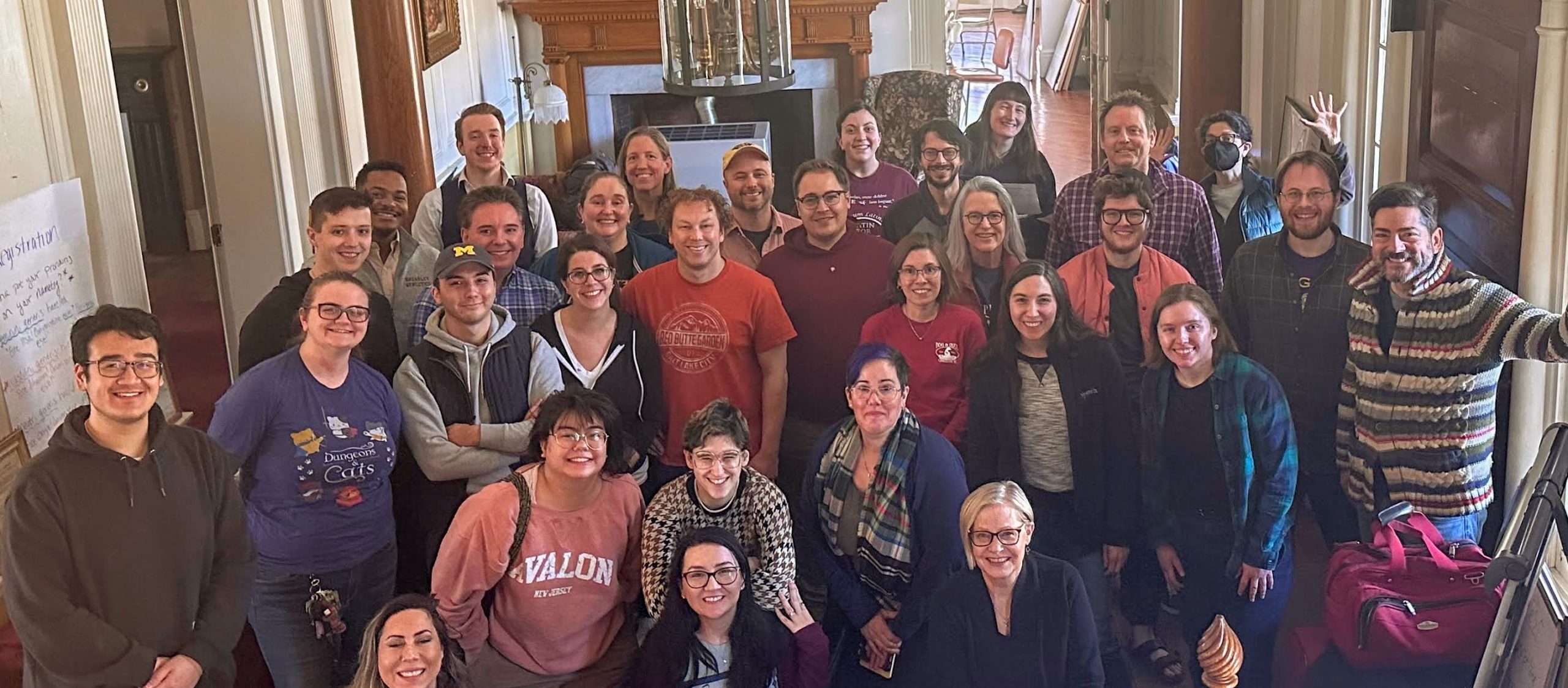Biduum participants gather for a group photo in the atrium of the Claymont mansion at the conclusion of a weekend of lively Latin speaking.