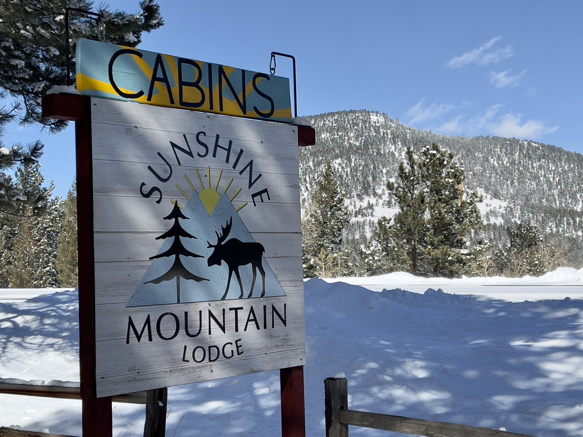 Lodge sign in snow
